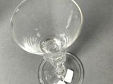 a wine glass that is sitting on a table