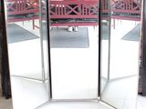 a room divider with a red bench in the middle of it