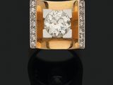 une bague en or jaune 18k et diamants