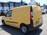 a yellow van that is parked in a parking lot