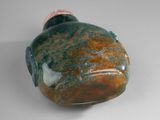a picture of a green and brown stone snuff