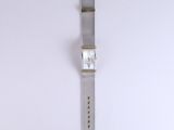 an image of a watch hanging on a wall on a white background