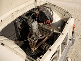 an old car with an engine in the back of it