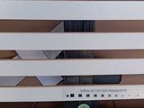 a rack that has a bunch of white and pink items on it