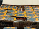 several boxes of beer sitting on top of a table next to a cardboard box