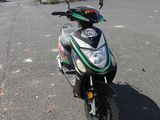 a scooter that is parked in a parking lot