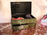 a small box with a pair of shoes in it on a table