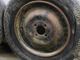 two tires that are sitting next to each other on the ground