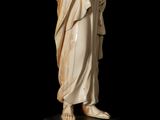 a carved ivory figure of a woman holding a child