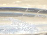 a close up of a glass of water on a table