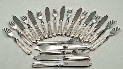 a lot of forks and knives that are on the table