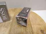 a box of lipstick sitting on a table next to a box of lipstick