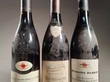 three bottles of wine sitting next to each other on a table