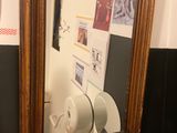 a mirror on the wall above a sink in a bathroom