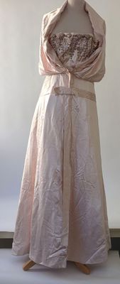 a dress on a mannequin stand in a room