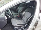 the interior of a car with two black seats and a steering wheel