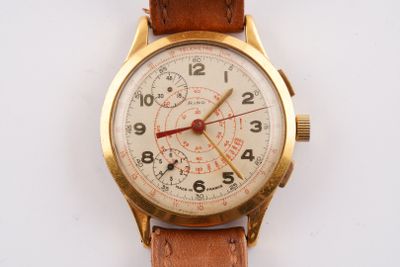 a watch that is sitting on a white surface