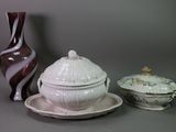 a white bowl and a pink bowl on a table