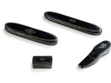 four different types of black leather items on a white surface