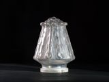 a glass vase that is sitting on a table