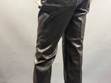 the back view of a mannequin mannequin wearing black leather pants