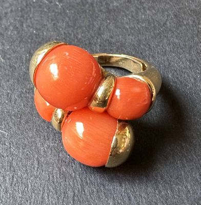 an image of a close up of an orange ring on a table