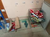 two baskets of presents on the floor next to a refrigerator