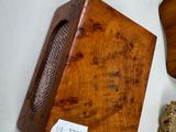 a wooden box with a plaque on it next to a wooden plaque