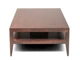 a close up of a coffee table with a shelf on top of it