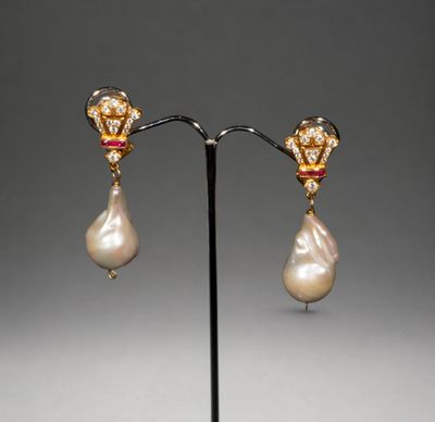 a pair of pearl and gold earrings