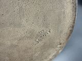 a close up of a vase and a bowl on a table