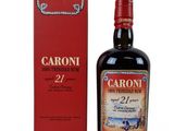 the bottle of caroni 27 year old is next to the box