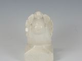 statue of a woman with a flowered head on a white background