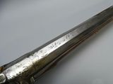 a large metal object that is on a white surface