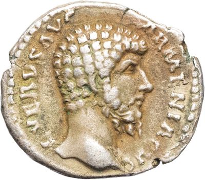 une pièce d'argent représentant la tête d'un homme coiffé d'une couronne