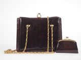 an image of a brown snake skin purse and chain purse