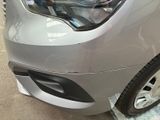 a close up of a car that has been painted silver