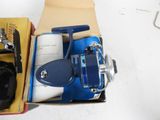 a box with a blue and white fishing reel and a blue and white reel