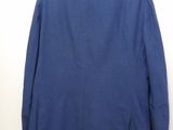 the back of a blue blazer jacket hanging on a hanger