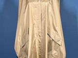 an image of a gold rain coat on a mannequin stand