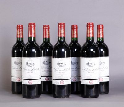 six bottles of red wine lined up in a row