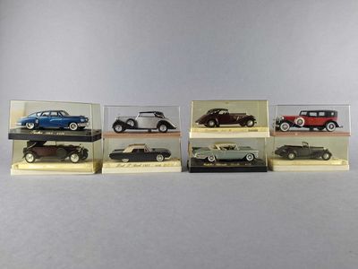 six different models of cars in a display case