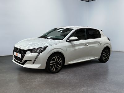 a white car is parked in a room with a white wall