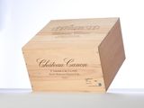 a wooden box with a bottle of wine inside of it