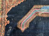 an old rug with a design of a horse on a blue ground