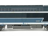 a blue and white train on the tracks on a white background
