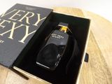 a bottle of very sexy in a box on a table