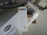 a bottle of liquid sitting on top of a box