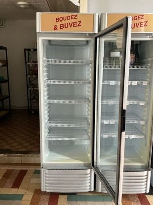 two refrigerated refrigerators in a store