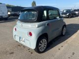 a small car that is parked in a parking lot